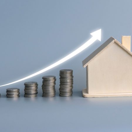 a-stack-of-ascending-coins-with-house-model-and-gl-2025-01-09-15-38-30-utc