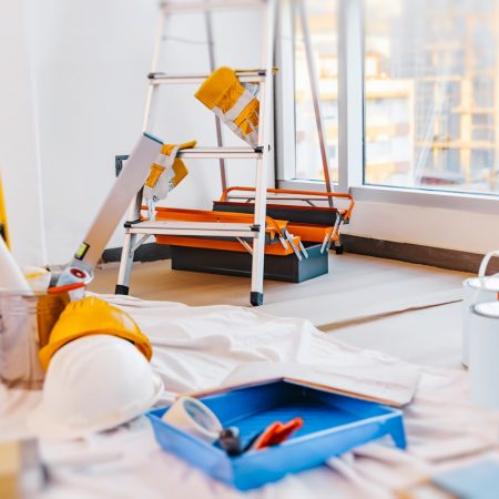 Still Life from Tools for Repair. Brush and Paint for Painting Walls, Ladder and Rulers. Decorative Renovation of a New Apartment.