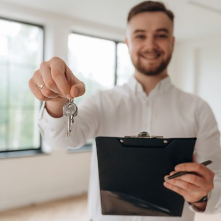 Real estate agent is in the new room.